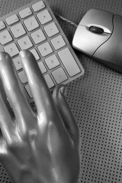 Hand on a computer keyboard